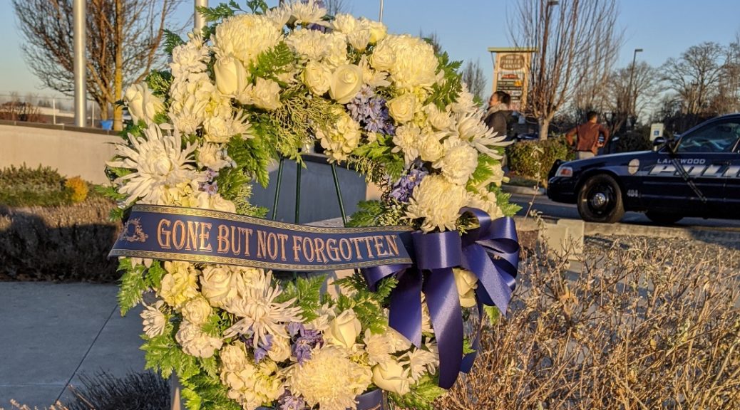 Wreath with "Gone But Not Forgotten" ribbon for slain Lakewood, Washington police officers