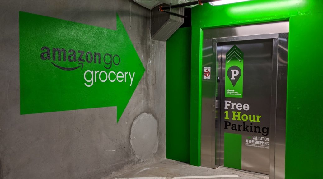 Bright green paint in the parking garage highlights the elevator to the Amazon Go Grocery store in Seattle